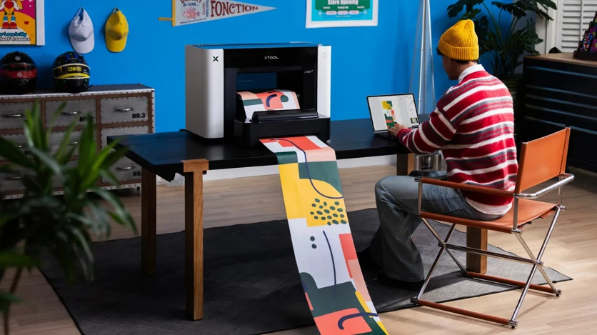 Long-format printing on the O1 Omni: the Roll Feeder handles canvas and adhesive vinyl up to 39 ft (11.8 m), or UV DTF transfer film up to 49 ft (15 m)
